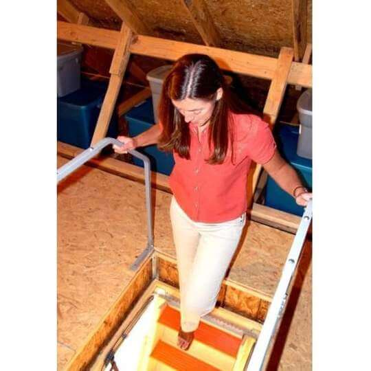 Versa Rail attic ladder safety rail VRM60 with woman holding handrail while going downstairs.